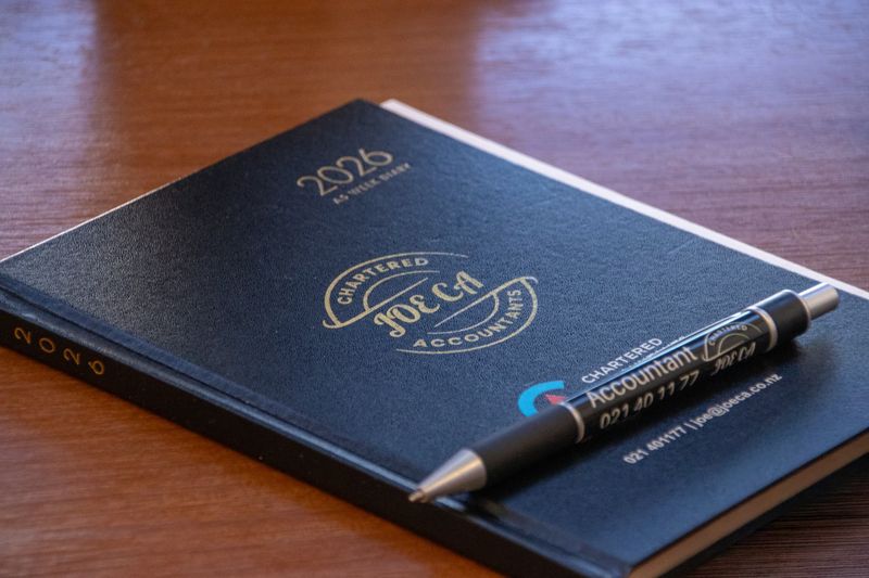 JOE CA branded 2026 diary and pen on a desk
